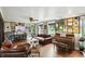 Cozy living room with hardwood floors, leather furniture, and ample natural light, showcasing a relaxed atmosphere at 750 N 500 W, Lebanon, IN 46052
