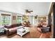 Inviting living room with hardwood floors, comfortable leather furniture, and a decorative ceiling fan at 750 N 500 W, Lebanon, IN 46052