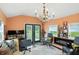 This living room offers a fireplace, decor, and view of the backyard at 750 N 500 W, Lebanon, IN 46052