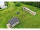The property features multiple outbuildings, including a greenhouse and storage shed at 750 N 500 W, Lebanon, IN 46052