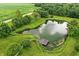 Scenic pond with a dock, surrounded by lush greenery and mature trees at 750 N 500 W, Lebanon, IN 46052