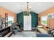 Bright room with colorful walls, featuring a fireplace, a window unit, and a chandelier at 750 N 500 W, Lebanon, IN 46052