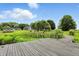 Picturesque waterfront view from a wooden dock, overlooking lush greenery and charming homes at 750 N 500 W, Lebanon, IN 46052