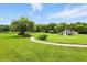 Scenic path through a well-manicured yard leading to an outbuilding at 750 N 500 W, Lebanon, IN 46052