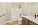 Bathroom featuring modern vanity, toilet and tub/shower combination at 7604 Brownstone Ct, Greenfield, IN 46140