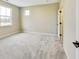 Comfortable bedroom featuring soft gray carpet and natural light at 7604 Brownstone Ct, Greenfield, IN 46140