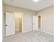 Bright bedroom with carpet and two closets with white doors at 7604 Brownstone Ct, Greenfield, IN 46140
