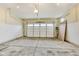 Spacious garage with high ceilings, concrete floor, and large door offers ample storage and parking at 7604 Brownstone Ct, Greenfield, IN 46140