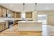 Modern kitchen with stainless steel appliances, a center island, and tile backsplash at 7604 Brownstone Ct, Greenfield, IN 46140