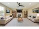 Spacious living room featuring a fireplace, built-in shelving, and stylish furnishings at 7604 Brownstone Ct, Greenfield, IN 46140