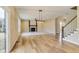 Spacious living room featuring a fireplace, large windows, and hardwood floors at 7604 Brownstone Ct, Greenfield, IN 46140