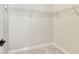 A smaller walk-in closet has a carpeted floor and basic metal shelving for storage and organization at 7604 Brownstone Ct, Greenfield, IN 46140
