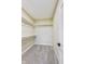 A walk-in closet has carpeted floor and basic white shelving for easy storage and organization at 7604 Brownstone Ct, Greenfield, IN 46140