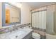 Traditional bathroom featuring a vanity with a marble countertop and a shower with a curtain at 767 Harvest Ridge Dr, Avon, IN 46123