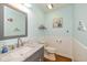 Charming bathroom with beadboard paneling, updated fixtures, and a vanity with a marble countertop at 767 Harvest Ridge Dr, Avon, IN 46123