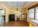 Dining area with dark wood floors, traditional lighting, and view to the kitchen at 767 Harvest Ridge Dr, Avon, IN 46123