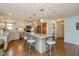 Open kitchen with a granite island, modern appliances, and hardwood floors at 767 Harvest Ridge Dr, Avon, IN 46123