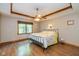 Comfortable bedroom with wood floors, ceiling fan, and ample natural light at 767 Harvest Ridge Dr, Avon, IN 46123