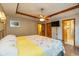 Relaxing main bedroom with wood floors, ceiling fan, and ensuite bathroom at 767 Harvest Ridge Dr, Avon, IN 46123