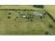Expansive aerial view showcasing the home and surrounding acreage at 7702 N County Road 300 W, Lizton, IN 46149