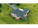 Aerial view of backyard patio with outdoor dining set and well maintained lawn at 7702 N County Road 300 W, Lizton, IN 46149