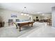 Basement entertainment area featuring a pool table, game table, bar, and seating at 7702 N County Road 300 W, Lizton, IN 46149
