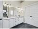 Elegant bathroom with double sinks, white cabinetry, and stylish vanity lighting at 7702 N County Road 300 W, Lizton, IN 46149