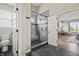 Modern bathroom featuring glass shower, toilet, and tile flooring at 7702 N County Road 300 W, Lizton, IN 46149