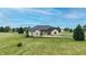 Beautiful exterior of brick home with well maintained landscaping at 7702 N County Road 300 W, Lizton, IN 46149