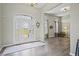 Elegant foyer with hardwood floors and decorative glass front door, offering a grand entrance and welcoming ambiance at 7702 N County Road 300 W, Lizton, IN 46149