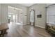 Spacious foyer with hardwood floors, complemented by a decorative front door and ample natural light from large windows at 7702 N County Road 300 W, Lizton, IN 46149