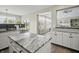 Modern kitchen with a view to the breakfast nook with sliding glass doors at 7702 N County Road 300 W, Lizton, IN 46149