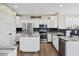 Well-lit kitchen with stainless steel appliances, white cabinetry, and a kitchen island at 7702 N County Road 300 W, Lizton, IN 46149