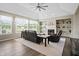 Comfortable living room with fireplace, built-in shelving, and expansive windows providing great natural light at 7702 N County Road 300 W, Lizton, IN 46149