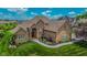 Stunning aerial view of brick home, highlighting its well-maintained landscaping and serene surroundings at 7845 Centerstone Ct, Indianapolis, IN 46259
