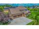 Aerial view showcasing home's brick exterior, roof, large driveway and backyard at 7845 Centerstone Ct, Indianapolis, IN 46259