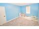 Brightly painted bedroom with carpeted flooring, toy kitchen and an ABC rug at 7845 Centerstone Ct, Indianapolis, IN 46259