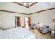 Spacious bedroom with vaulted ceiling, wood trim, sitting area and two entry doors at 7845 Centerstone Ct, Indianapolis, IN 46259