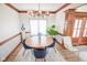Cozy dining room featuring a modern chandelier, elegant decor, and plenty of natural light at 7845 Centerstone Ct, Indianapolis, IN 46259