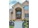 Welcoming front entrance featuring double doors, stylish brickwork, and beautiful potted plants at 7845 Centerstone Ct, Indianapolis, IN 46259