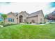 Attractive brick home with lush green lawn, tasteful landscaping, and inviting walkway at 7845 Centerstone Ct, Indianapolis, IN 46259