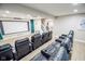 Enjoy movies in this home theater with tiered seating and a projector at 7845 Centerstone Ct, Indianapolis, IN 46259