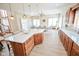 Spacious kitchen featuring a quartz countertop island and wooden cabinetry with stainless steel appliances at 7845 Centerstone Ct, Indianapolis, IN 46259