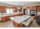 Spacious kitchen with cherry cabinets, island, quartz countertops and stainless steel appliances at 7845 Centerstone Ct, Indianapolis, IN 46259
