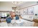 Well-lit open living area with modern furnishings and view to dining area and entryway at 7845 Centerstone Ct, Indianapolis, IN 46259