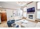 Spacious living room with tall ceilings, a fireplace, and comfortable seating arrangement at 7845 Centerstone Ct, Indianapolis, IN 46259