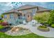 Charming outdoor patio featuring a fire pit, plush seating, and beautiful landscaping for relaxing and entertaining at 7845 Centerstone Ct, Indianapolis, IN 46259