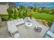Expansive patio with a modern fire pit and comfortable sectional seating, perfect for outdoor gatherings at 7845 Centerstone Ct, Indianapolis, IN 46259