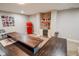Spacious recreation room features a long table and a refrigerator for entertainment at 7845 Centerstone Ct, Indianapolis, IN 46259