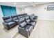 Home theater room with tiered seating, providing an immersive viewing experience at 7845 Centerstone Ct, Indianapolis, IN 46259